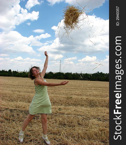 Young woman in yellow field with hay. Young woman in yellow field with hay