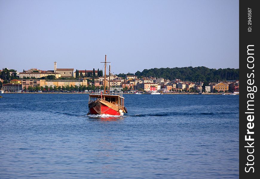 Old wooden ship  in the small harbor