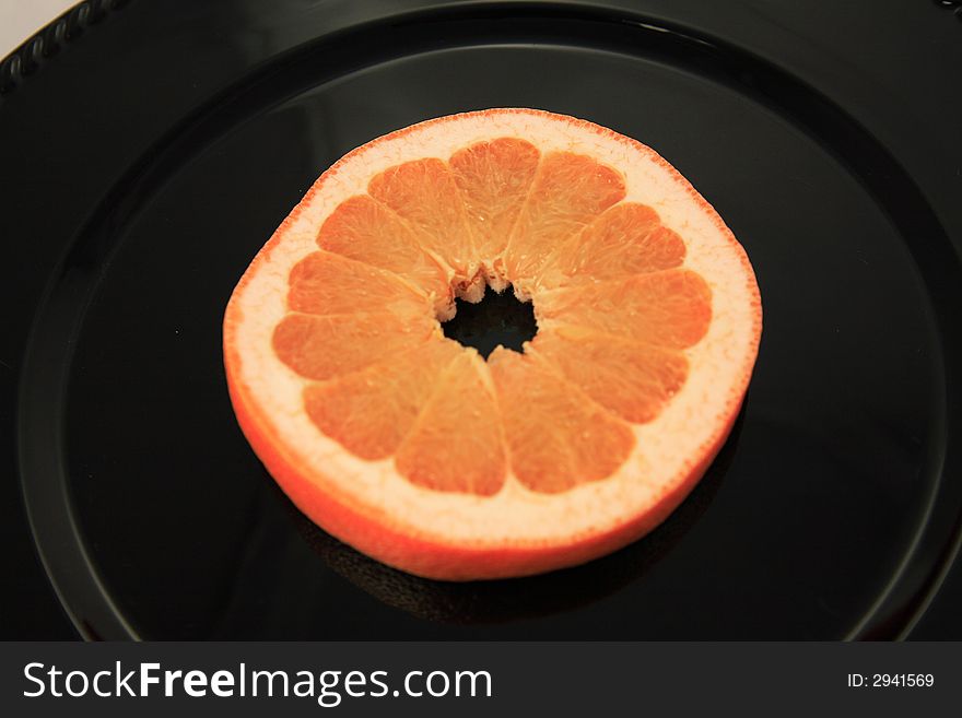 Fresh Grapefruit on a colorful charger. Fresh Grapefruit on a colorful charger