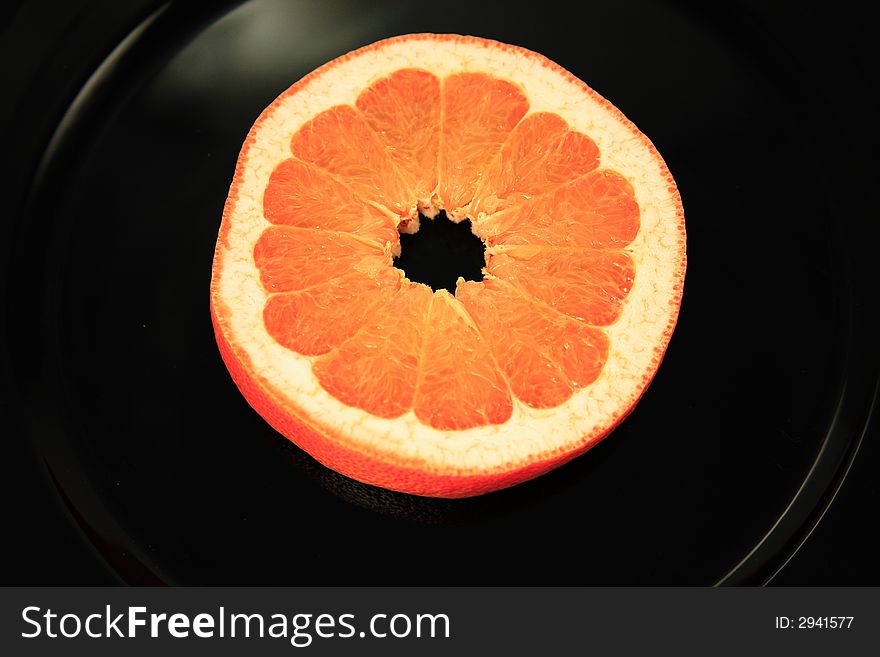 Fresh Grapefruit on a colorful charger. Fresh Grapefruit on a colorful charger