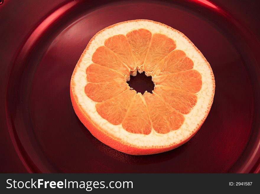 Fresh Grapefruit on a colorful charger. Fresh Grapefruit on a colorful charger