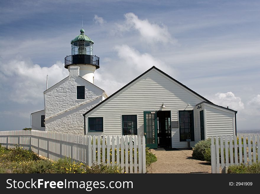 Point Loma Lighthouse San Diego California, famous landmark at Cabrillo National Monument on peninsula overlooking San Diego skyline and bay