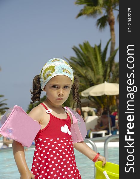 Portrait of a child playing by the pool. Portrait of a child playing by the pool