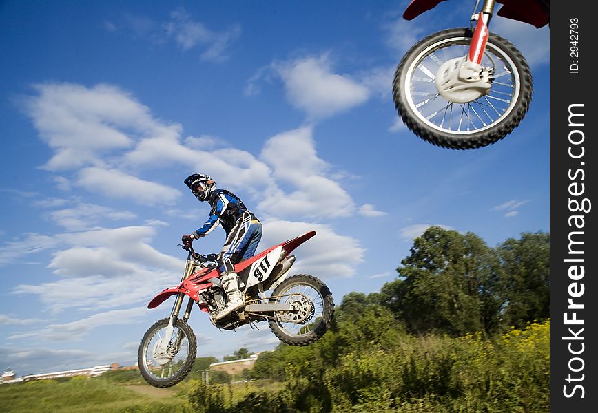 The motocross riders in the air. The motocross riders in the air