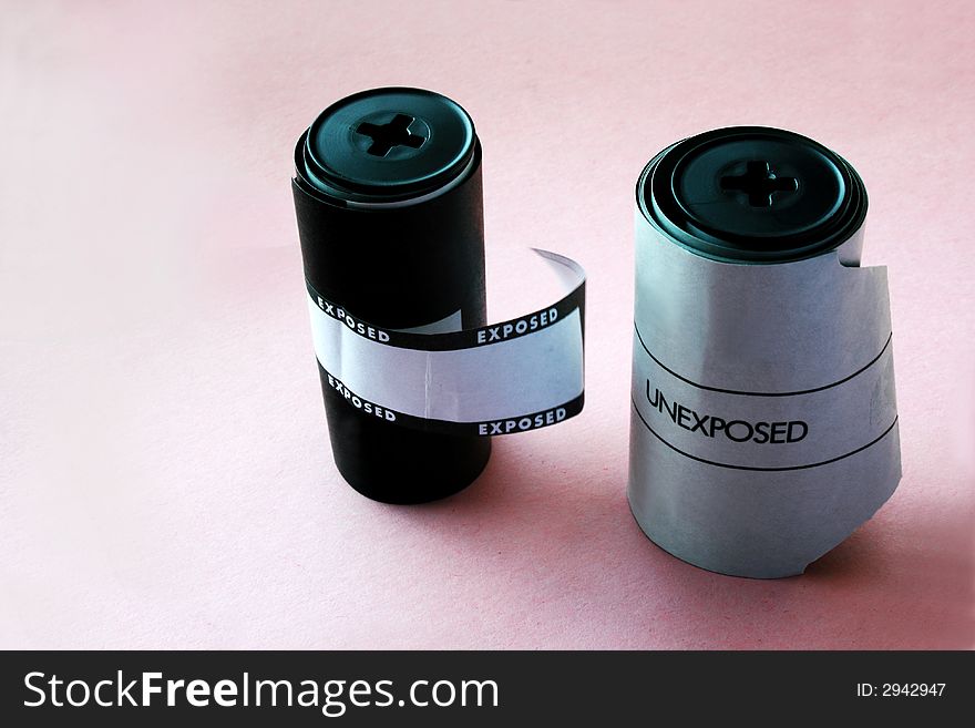 Two filmrolls, exposed and unexposed, for Hasselblad camera. With copy space. Two filmrolls, exposed and unexposed, for Hasselblad camera. With copy space.
