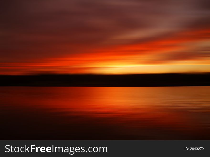 Deliberatly blurred abstract of a sunrise over Percy Priest Lake in Nashville. Deliberatly blurred abstract of a sunrise over Percy Priest Lake in Nashville
