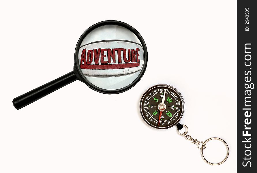 An image of magnifier and compass. An image of magnifier and compass