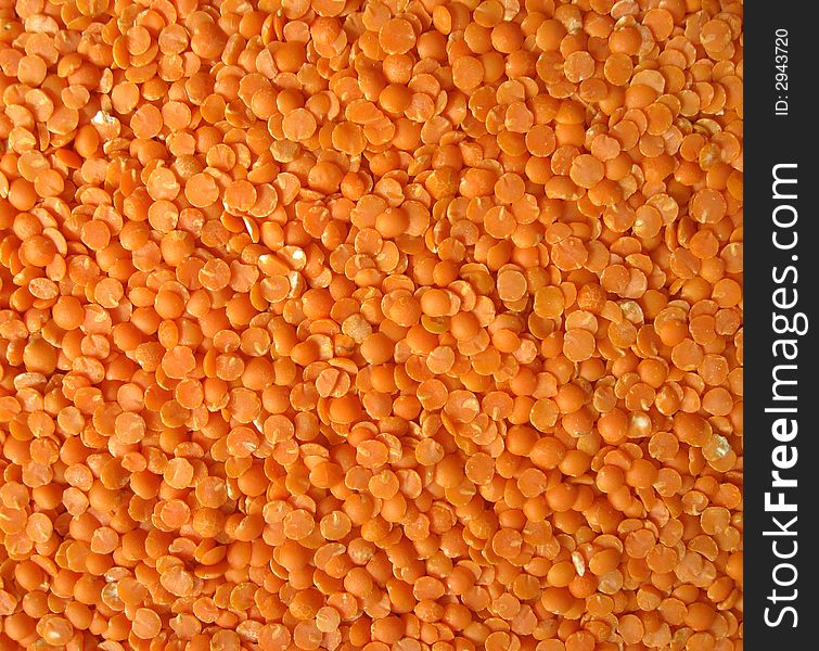 Background. Heap of a red split lentils. Background. Heap of a red split lentils