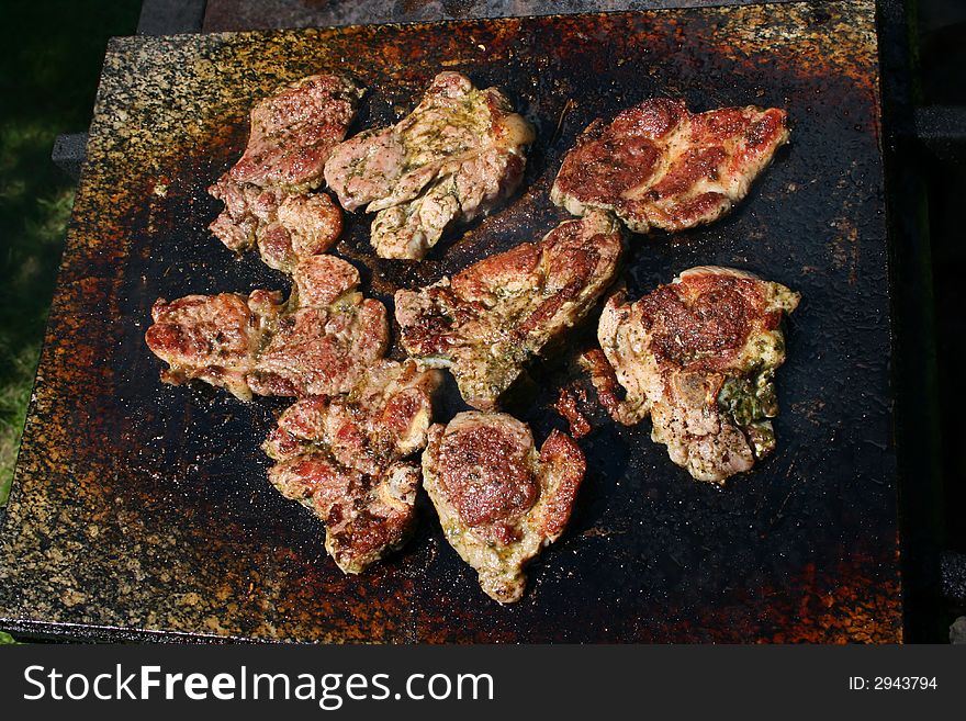 Baking pieces of meat on grill. Baking pieces of meat on grill