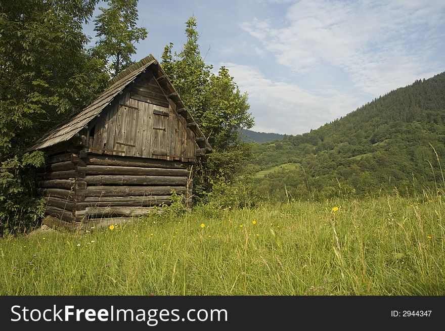 Wooden house for storing hay during winter in the slovak countryside.