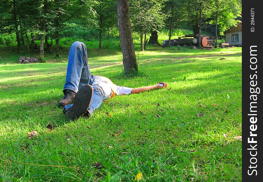 Boy lying ground grass field