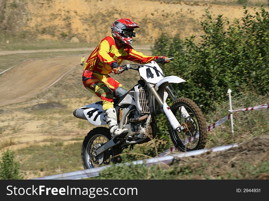 The sportsman on a motorcycle overcomes a steep slope. The sportsman on a motorcycle overcomes a steep slope