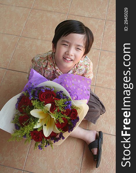 Boy holding rose bouquet