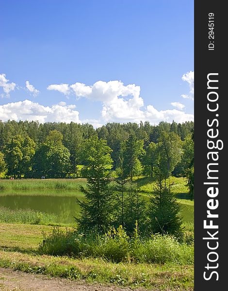 Landscape with blue sky, clouds, forest and lake. Landscape with blue sky, clouds, forest and lake