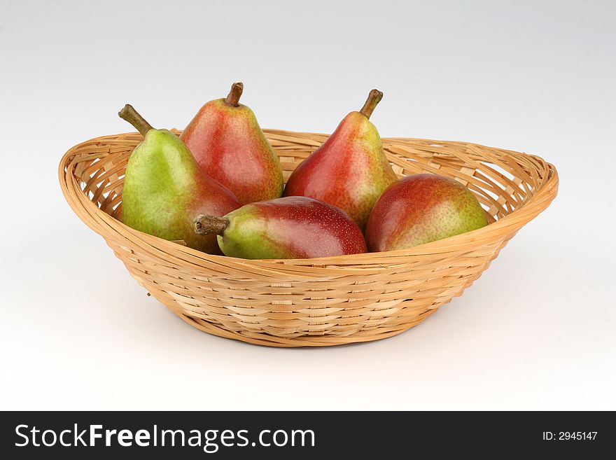 Fresh pears on a basket