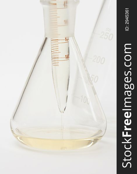 Detail of chemical glassware on a white background. Detail of chemical glassware on a white background