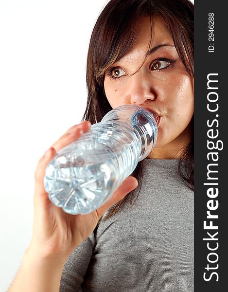 Attractive woman with bottle isolated on white background. Attractive woman with bottle isolated on white background