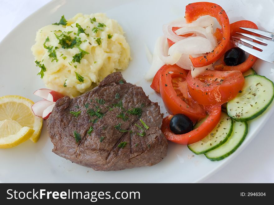 Steak medium with vegetable,salad,puree. Steak medium with vegetable,salad,puree.