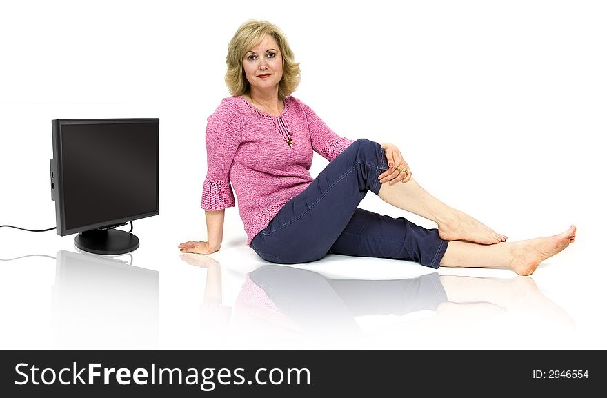 Beautiful middle-aged woman with a computer monitor. Beautiful middle-aged woman with a computer monitor