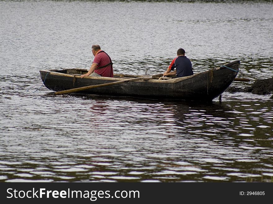 Irish men fishing in currach