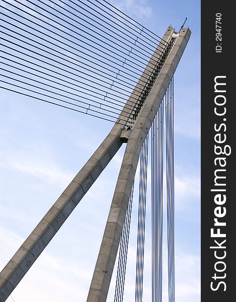 Part of the cable stayed bridge on blue sky. Part of the cable stayed bridge on blue sky