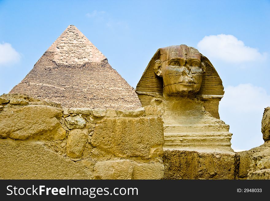 The great sphinx guarding a pyramid. The great sphinx guarding a pyramid
