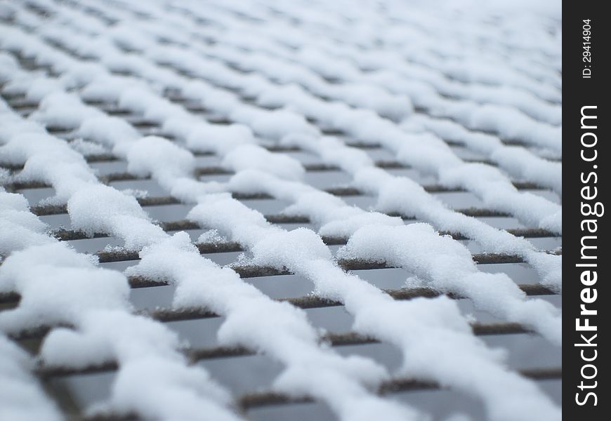 Grid close-up, grid in the snow, texture grid. Grid close-up, grid in the snow, texture grid