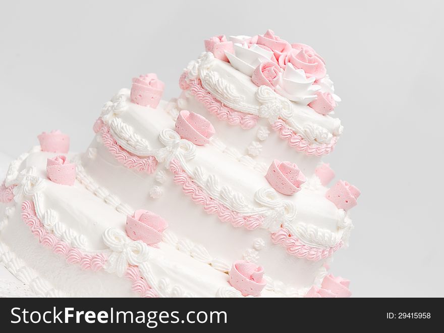 Pink and white delicious luxurious wedding cake with roses