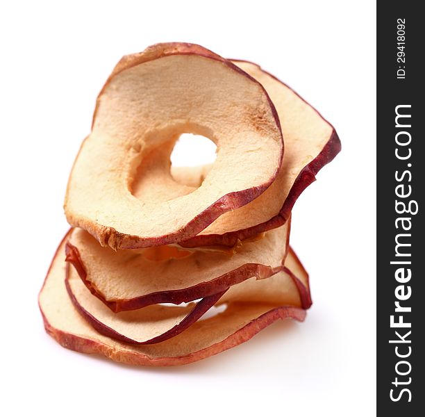 Dried apples in closeup on a white background