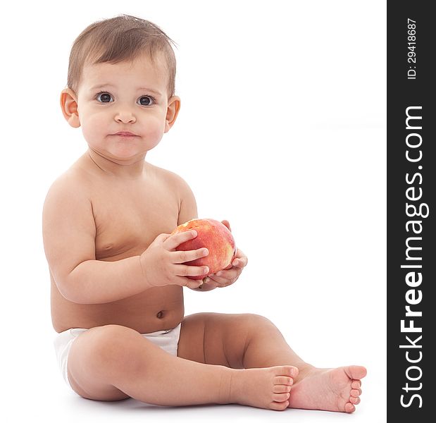 Cute confused little girl with apple in her arms. Isolated on a white background. Cute confused little girl with apple in her arms. Isolated on a white background.