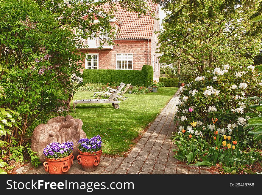 Entrance to a beautiful country garden in slight HDR