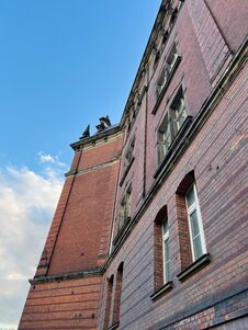 Gdansk, Poland - 08.08.2022: Gdansk, Poland - 08.08.2022: The Facade Of An Old Red Brick Building. Potholes On The Facade. Royalty Free Stock Image
