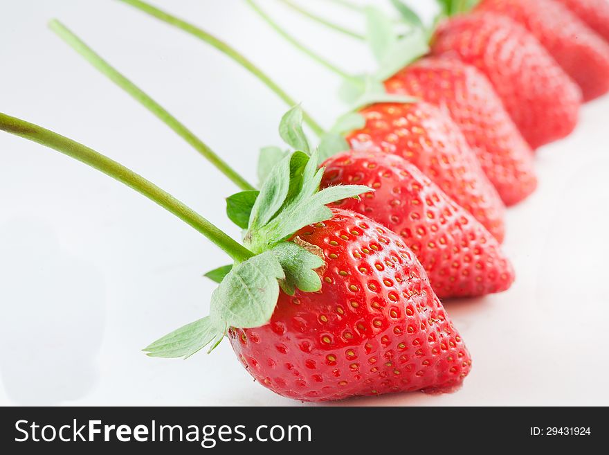 Fresh strawberries in a line. Fresh strawberries in a line