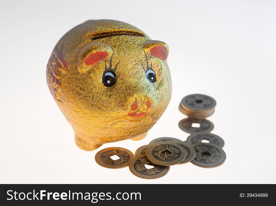 Chinese traditional piggy bank and ancient copper coins. Chinese traditional piggy bank and ancient copper coins