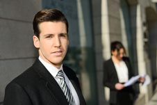 Attractive Young Businessmam And Businesswoman In Urban Backgrou Stock Photo Attractive Young Businessmam And Businesswoman In Urban Backgrou Stock Photo