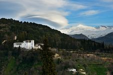 Alhambra And Snowing Sierra Nevada Mountains Under A Lenticular Royalty Free Stock Image Alhambra And Snowing Sierra Nevada Mountains Under A Lenticular Royalty Free Stock Image