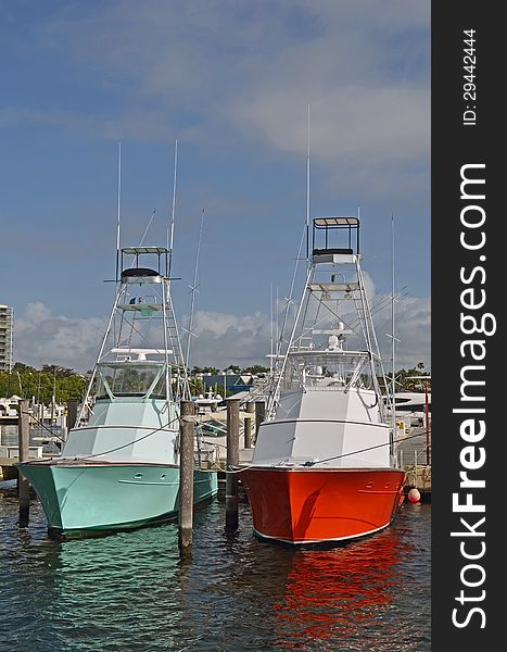 Two sport fishing boats available for charter moored at a marina in Coconut Grove,Florida