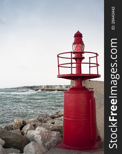 Little red lighthouse in the sea