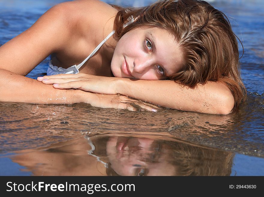 Closeup of a young woman on the beach. Closeup of a young woman on the beach