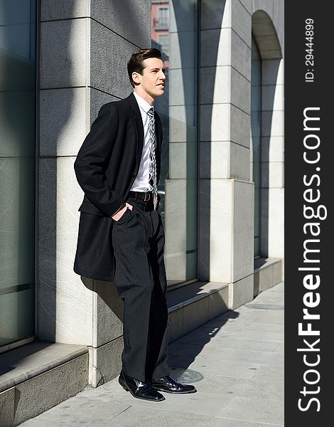 Attractive Young Businessman In Urban Background