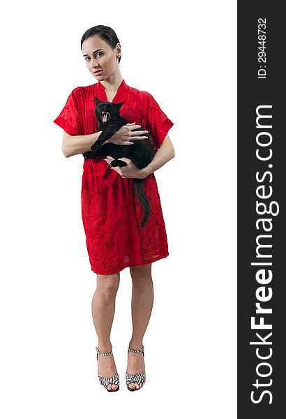 Young girl in red dressing gown with kitten isolated white