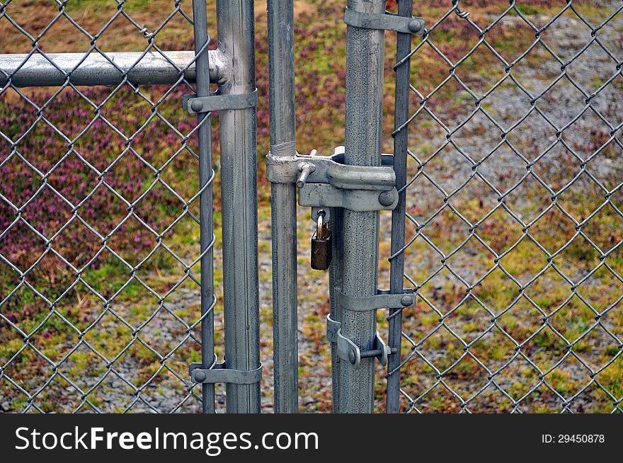 An image of a security fence with a Lock