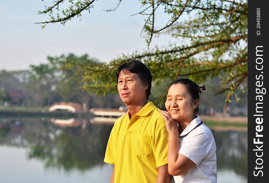 Happy couple at beautiful park outdoor in nature