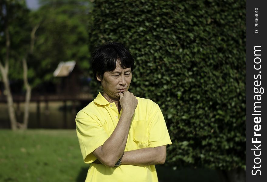 Portrait of a senior man, being thoughtful, outdoors.