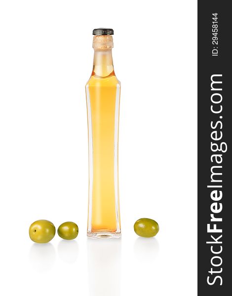 A Bottle Of Olive Oil And Fresh Green Olives.