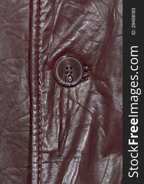 Brown leather shiny texture with seam and button. Brown leather shiny texture with seam and button