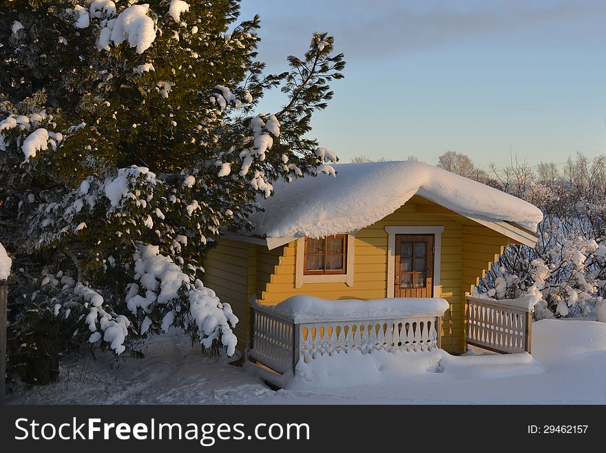 Snow-covered cottage