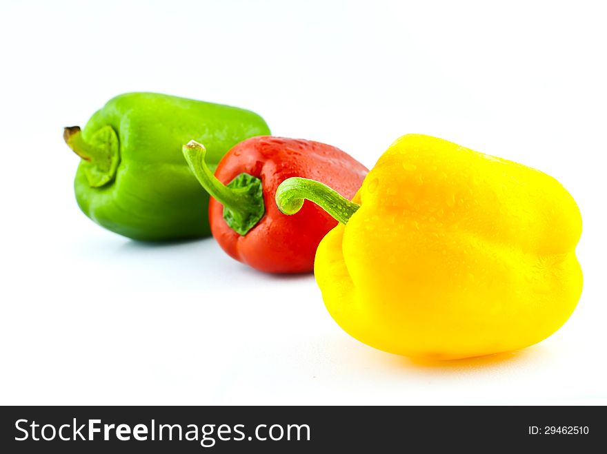 Three colors Paprika isolated on white .