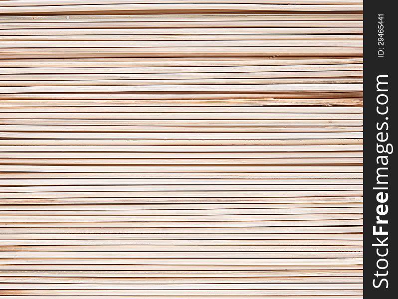 Long thin wooden sticks as a natural background. Long thin wooden sticks as a natural background