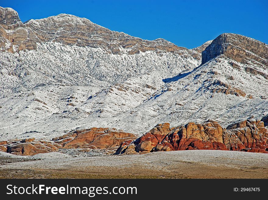 Red Rock Canyon National Conservation Area west of Las Vegas is made into a winter wonderland by a recent snowstorm. The image shows Turtle Head Peak at the upper right with the La Madre Mountains at left..The lower part of the images is the red, Aztec Sandstone. Red Rock Canyon National Conservation Area west of Las Vegas is made into a winter wonderland by a recent snowstorm. The image shows Turtle Head Peak at the upper right with the La Madre Mountains at left..The lower part of the images is the red, Aztec Sandstone.